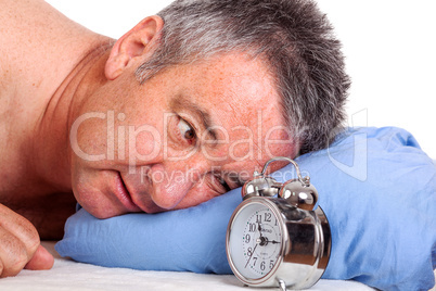 Man can not sleep and looked at the alarm clock