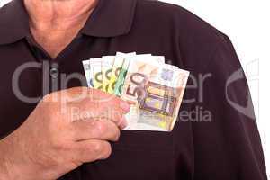 Man pushes money into his breast pocket