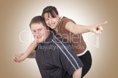 Man carrying woman piggyback