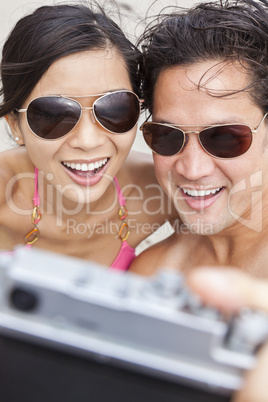 Asian Couple at Beach Taking Selfie Photograph