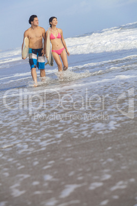 Asian Man Woman Surfers on Beach