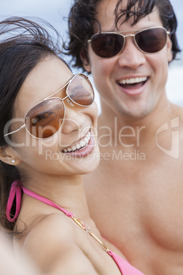 Asian Couple at Beach Taking Selfie Photograph