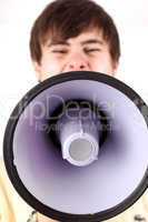 Young man shouting into the megaphone