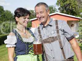 Man and woman with beer mug in Bavaria