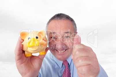 Man with piggy bank holding thumbs up