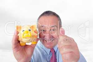 Man with piggy bank holding thumbs up