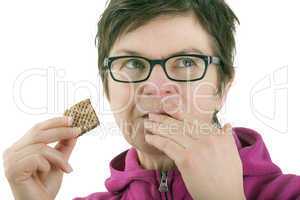 Woman eating biscuit