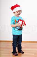 Child with santa hat and gift packs