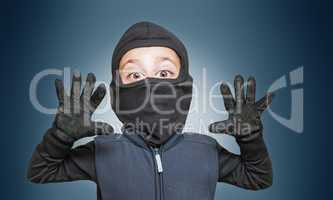 Surprised comic burglar stopped and take his hands up