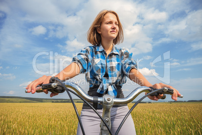 Portrait of a girl with a bicycle