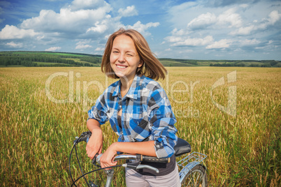 Portrait of a girl with a bicycle