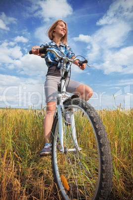 Portrait of a girl with a bicycle