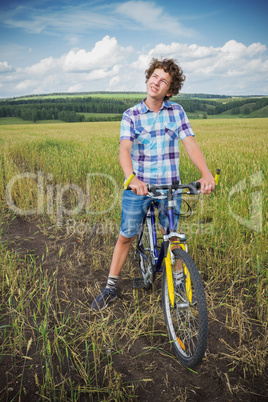 Portrait of a boy with a bicycle