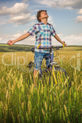 Portrait of a boy with a bicycle