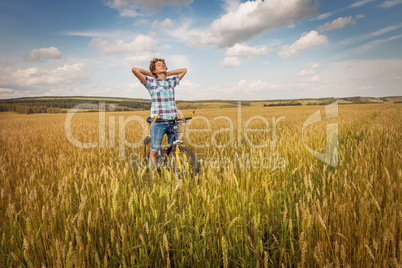 Portrait of a boy with a bicycle