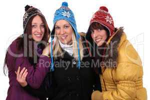 Gruppe von jungen Frauen im Winter mit Mütze und Handschuhen di