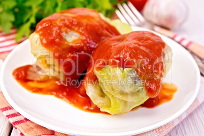 Cabbage stuffed with tomato sauce on plate