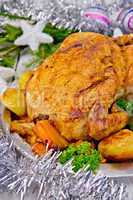Chicken Christmas with vegetables and silver tinsel