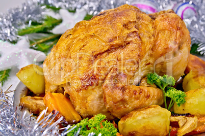 Chicken Christmas with vegetables and silver toys