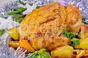 Chicken Christmas with vegetables and silver toys