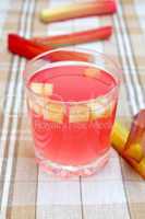 Compote from rhubarb in glass on tablecloth