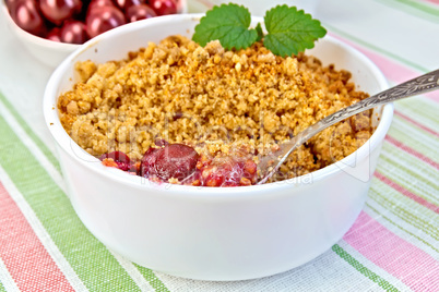 Crumble cherry with berries on napkin