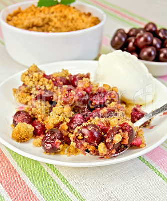 Crumble cherry with berries on plate