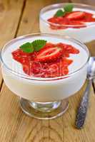 Dessert milk with strawberry in goblet on board