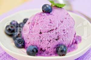 Ice cream blueberry with mint on plate