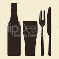 Bottle, glass of beer and cutlery