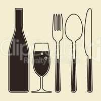 Bottle, glass of champagne, fork, knife and spoon