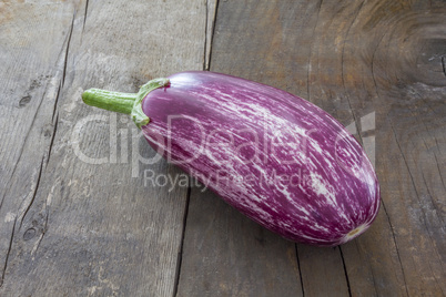 Two Aubergines on wooden board