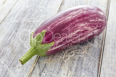 Aubergine on white table