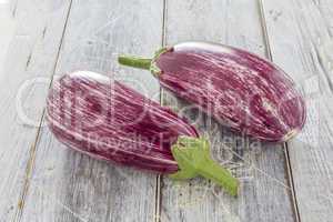 Two Aubergines on table