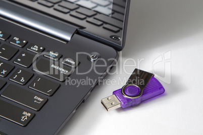 laptop keyboard and flash drive