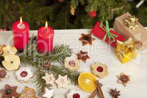 table with gifts and christmas candles