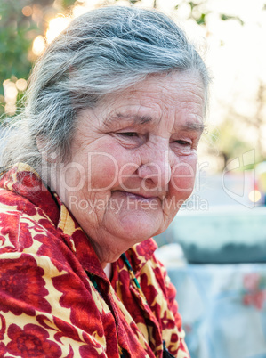 Senior woman on the background of his home