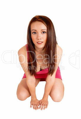 Crouching woman on floor.