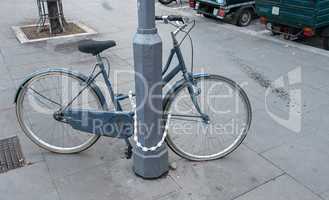 Locked bicycle on a post, Rome - Italy