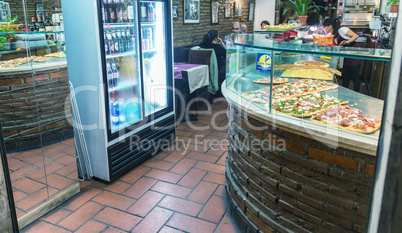 ROME - NOVEMBER 2, 2012: Tourists enjoy a city pizzeria at night