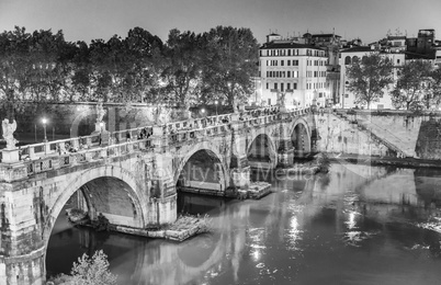 Rome. Lungotevere at night with city bridge