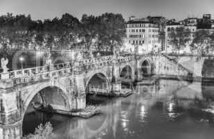 Rome. Lungotevere at night with city bridge