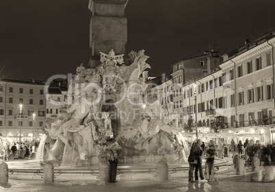 ROME - NOVEMBER 2, 2012: Tourists enjoy Piazza Navona at night.