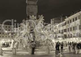 ROME - NOVEMBER 2, 2012: Tourists enjoy Piazza Navona at night.