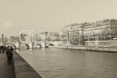 PARIS - NOVEMBER 28, 2012: Tourists enjoy the view of Seine rive