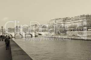 PARIS - NOVEMBER 28, 2012: Tourists enjoy the view of Seine rive