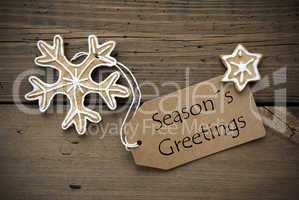 Season's Greetings on a Banner with Ginger Bread Cookies