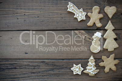 Decorated Ginger Bread Cookies on Wooden Plank