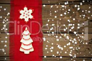 Cookies on Snowy Wooden Background