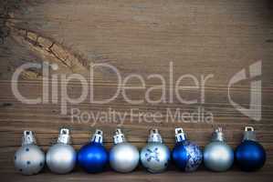 Christmas Balls Lying on Wood with Copy Space